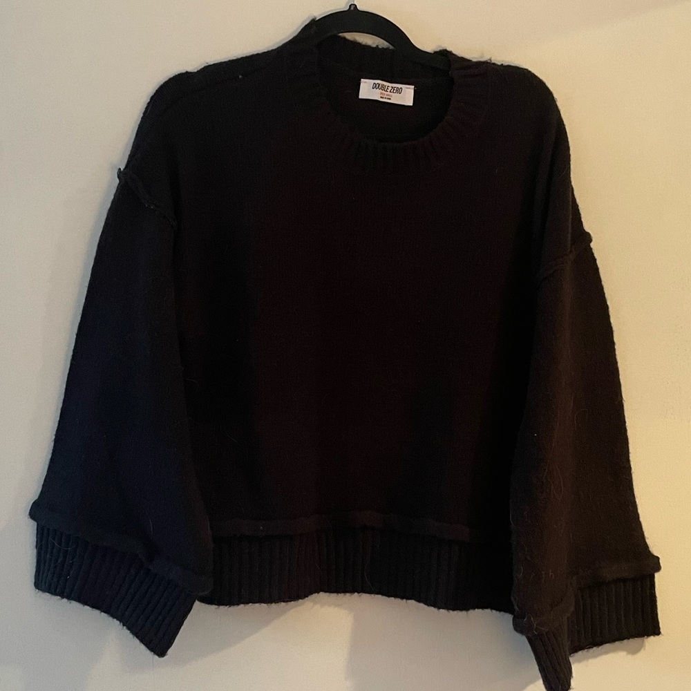 Black sweater, little cropped